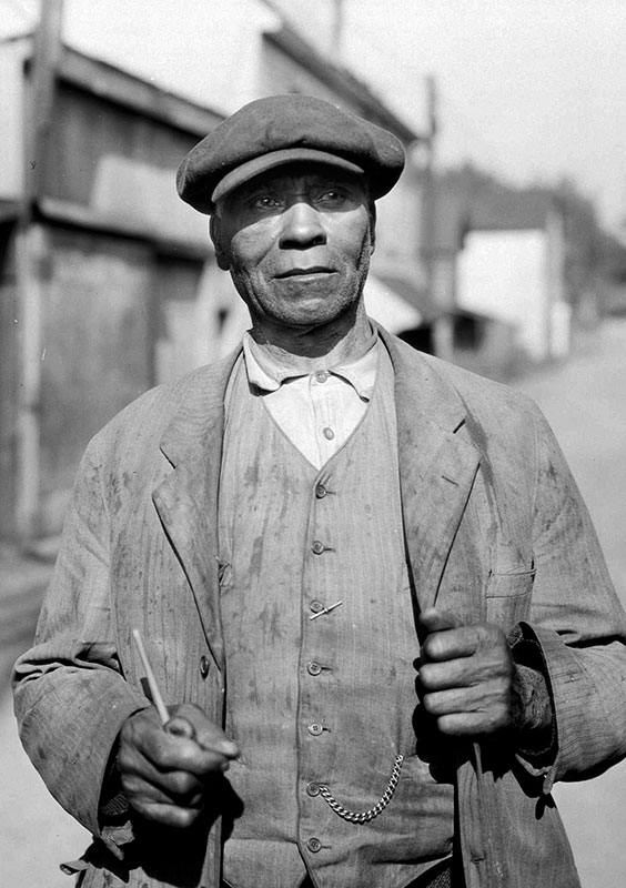 Fielding William Spotts came to British Columbia with the first wave of black immigrants from California in the 19th century. Here he is in Hogan's Alley in 1935, at the age of 78, when he lived at 217 1/2 Hogan's Alley. City of Vancouver Archives #Port N3.1.