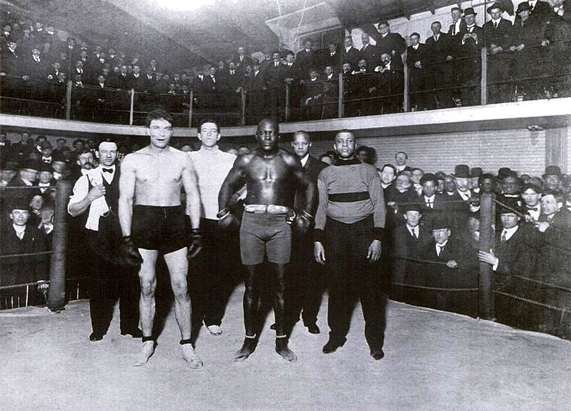Jack Johnson's first fight after becoming the first black heavyweight boxing champion of the world was a demonstration match at the Vancouver Athletic Club in Beatty Lane. He beat Victor MacLaglan, who later found more success as a Hollywood actor. On Johnson's right is George Paris, manager of the club. Photo courtesy Heritage House.