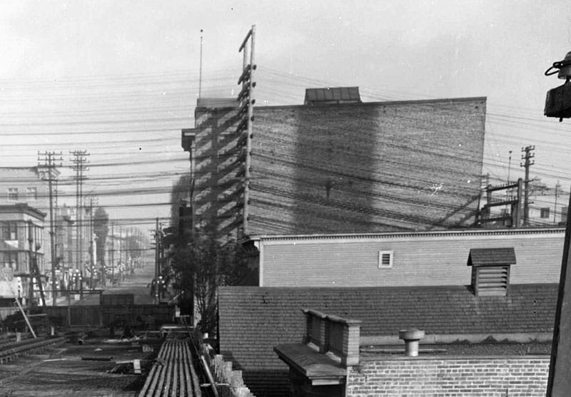 Looking east toward Main Street during construction of the first Georgia Viaduct around 1914. The large building is the rear of the Avenue Theatre and just below it is the top of the Lincoln Club. City of Vancouver Archives #LGN 1188 (cropped)