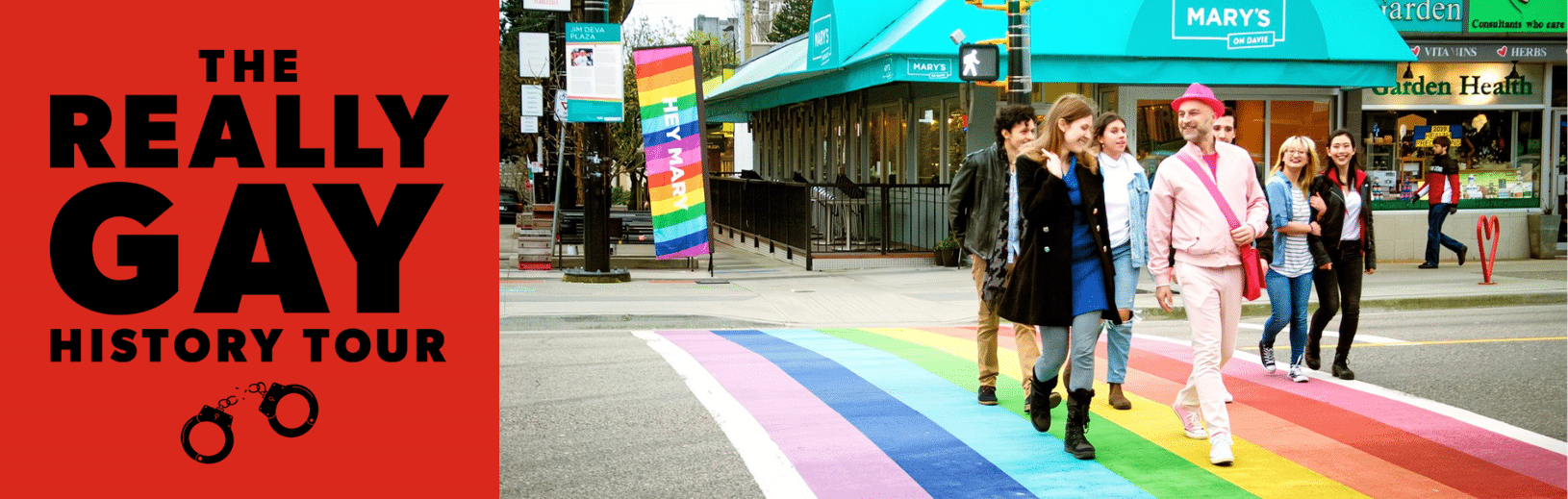 Glenn, the tour guide, is dressed in all pink, leading a group of guests across Vancouver's rainbow sidewalk on Davie Street. On the left is a logo of the Really Gay History Tour, a red background with black block lettering.