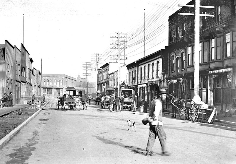 The Last Brothel in Vancouver's Chinatown 3 Vintage photograph of Dupont Street in 1906, west of 111 Dupont, featuring the historic Wing Sang building, a key part of early Vancouver Chinatown.