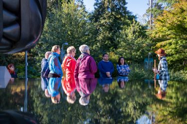 Best Vancouver Experiences for Senior Travellers 3 A small group on an accessible tour in Vancouver listening to a guide, highlighting the best Vancouver experiences for senior travellers who enjoy culture and senior-friendly activities