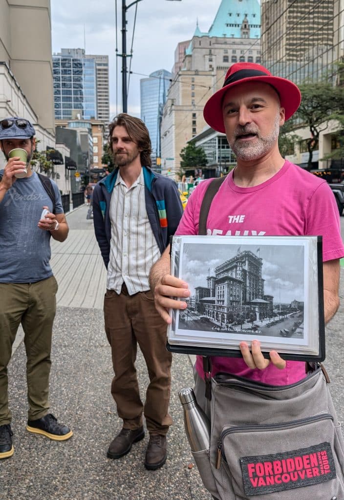 Corporate Pride Month activities Vancouver An image of Glenn Tkach leading the Really Hay History Tour on Burrard Street